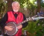   Gerald P. Murphy playing banjo in his back yard in Yreka, California