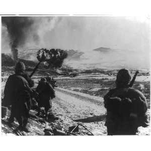   advancing along road,explosions ahead,Marine air strike,Korea,c1952