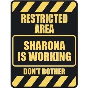   RESTRICTED AREA SHARONA IS WORKING  PARKING SIGN