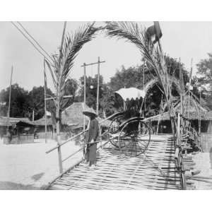 com 1889 photo Man posed with pousse pousse in Tonkin Village, Paris 