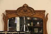   period chest or dresser has a swivel shaped and beveled mirror