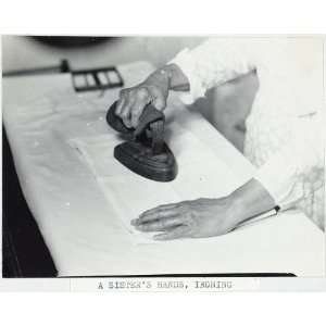   sisters hands,ironing,Hancock Shaker Village,MA,1931