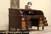   roll top desk from the early 1900 s has a superb deep rich finish