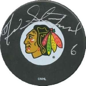  Fred Stanfield autographed Hockey Puck (Chicago Black 