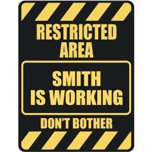   RESTRICTED AREA SMITH IS WORKING  PARKING SIGN