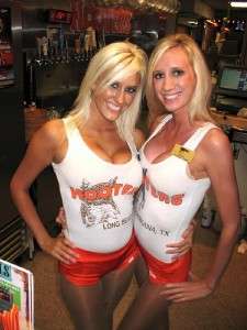 This is an authentic Hooters Girl name badge. The badge reads Nicki 