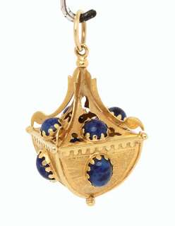   is a beautiful vintage 18k gold and lapis geometric charm pendant the