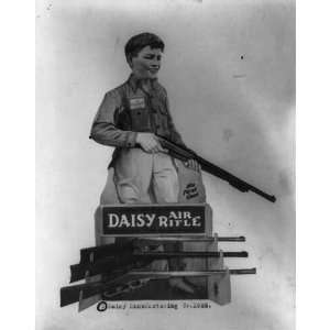   ,boy holding air rifle,Daisy Air Rifles,c1926,rack