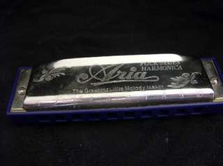 For your consideration, a Hohner Aria folk/blues harmonica in the key 