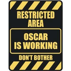   RESTRICTED AREA OSCAR IS WORKING  PARKING SIGN