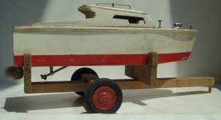 Vintage Chris Craft style wooden toy motor boat. It has the motor, a 