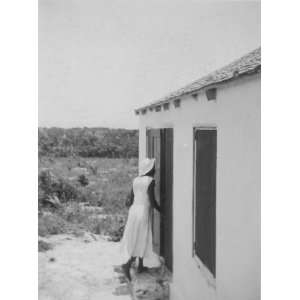  Rear view of woman entering housefrom taken by Alan Lomax 