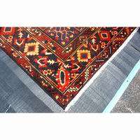   rug red black background with blue yellow and green details type