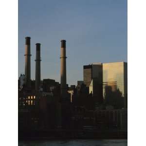  Smoke Stacks and High Rise Buildings on a City Skyline 
